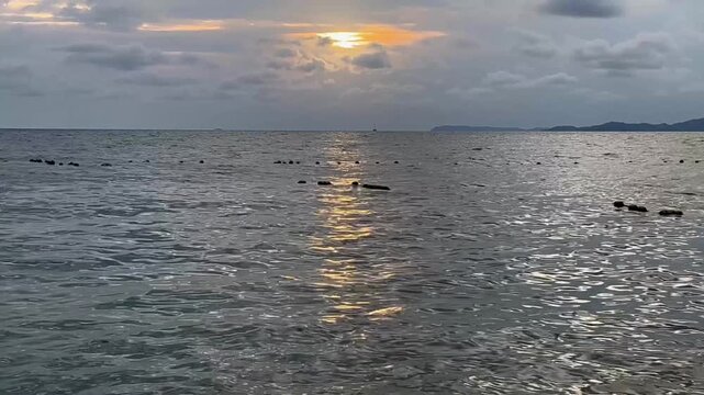Sunset reflection sea waves
