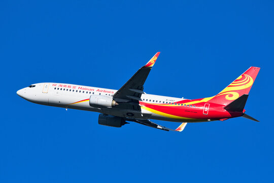 Hainan Airlines Boeing 737-800 (B-1497) passenger plane climbing after takeoff at Narita International Airport