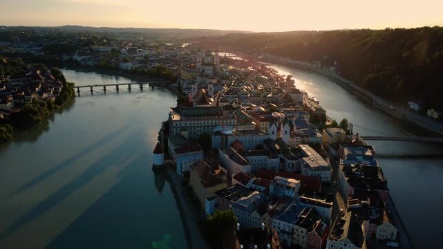Aerial view of Passau old town at the confluence of three rivers in warm sunset light