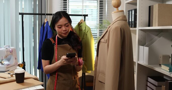 Fashion designer creating garment patterns, measuring fabric, inspecting clothing quality, and preparing apparel in a professional studio for tailoring, production, and fashion design workflow.
