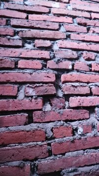 Authentic red brick wall with natural clay tones and gray mortar lines, Perfect for background texture overlays, architectural intros, urban design, motion graphics base layers, rustic or industrial 