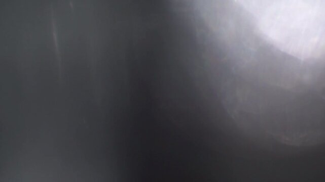 Vintage leaks bright optical flare creating subtle ghosted lens reflections