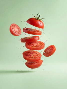 Fresh vegetable concept illustration with floating tomato slices and liquid splash, healthy food background
