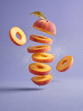 Fresh tropical fruit concept illustration with floating red guava slices and liquid splash, healthy food background