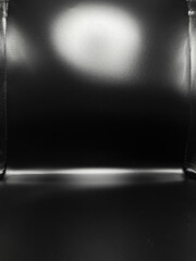 Obraz premium Empty black studio lightbox backdrop with top gradient lighting