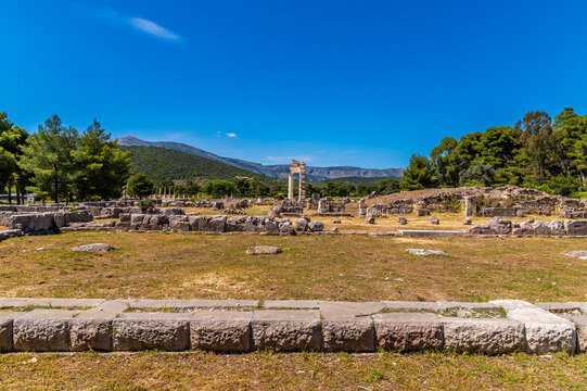 A view across ruins at the archaeological ruins of the Sanctuary of Asclepius at Epidaurus in early summertime