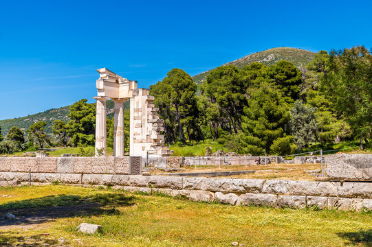 A view towards ruins of Tholos at the archaeological ruins of the Sanctuary of Asclepius at Epidaurus in early summertime