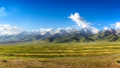 Obraz premium Vast Mountain Landscape Panorama In Kyrgyzstan Under Blue Sky