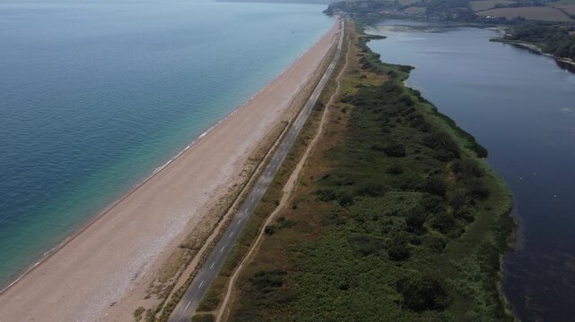 Aerial drone view of the abandoned Slapton Ley road and coastline, South Devon, England