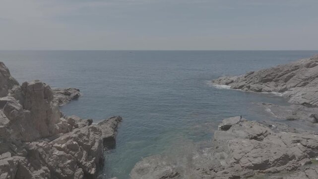 Aerial drone footage of kayaking over seaweed beds at Hon Kho, Gia Lai, Vietnam, featuring crystal-clear water, tropical coastline and an active outdoor adventure near Quy Nhon.