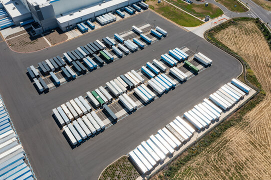 Woodburn, Oregon, USA - June 19, 2026 - Aerial drone photo of Amazon Fulfillment Center PDX8 with warehouse buildings, loading docks, trailers and logistics operations