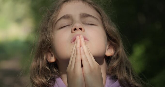 Religion. Child Girl Folded Lifestyle Her Hands in Prayer Pray to God on Outdoor. Worried Teenager Girl Looking for Hope and Faith Praying to God. Religious Child With Hope in His Heart Prays to God.