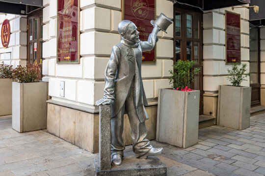Statue of Schone Naci by Juraj Melis, a famous life size bronze statue  located in the Old Town of Bratislava, Slovakia.