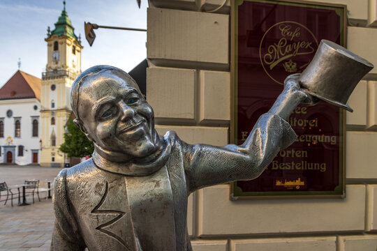 Statue of Schone Naci by Juraj Melis, a famous life size bronze statue  located in the Old Town of Bratislava, Slovakia.