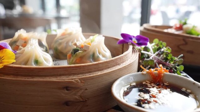 Fresh Steaming Hot Vegetable Dim Sum in Bamboo Steamer Basket with Soy Dipping Sauce and Garnish