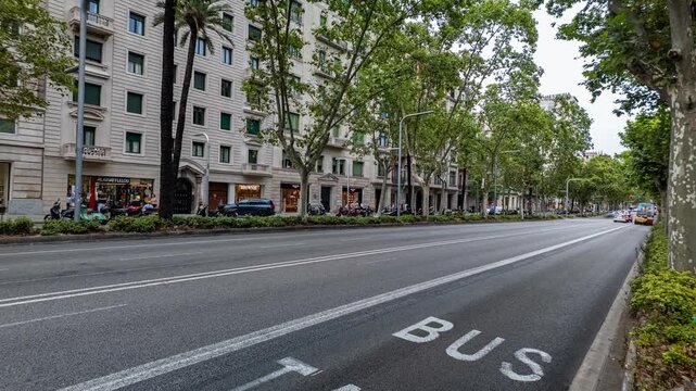 Barcelona, Spain. July 24, 2026, Heavy city traffic moving fast along the bus and taxi lane on Diagonal Avenue in Barcelona, a major commercial and financial hub