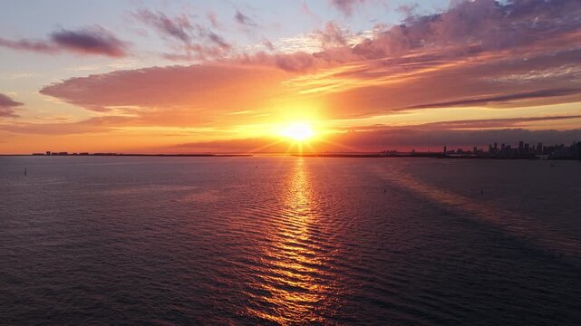 Sunset cloudy sky. Seascape at summer vacation. Skyscape with sea horizon. Horizon sunrise sea with ship. Sunrise seascape. Romantic summer vacation Florida seascape. Sea sunset horizon