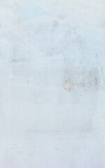 Obraz premium Minimalist off-white painted concrete wall background featuring subtle scratches, faint stains, and soft texture, providing a clean surface for graphic designs and overlays.