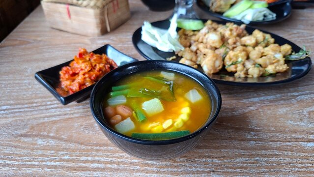 Sayur asam, sayur asem or tamarind soup is a popular traditional Indonesian soup. Common ingredients are chayote, long beans and corn with the addition of tamarind
