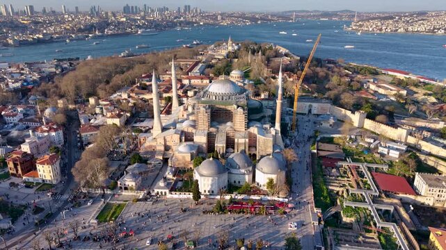 Aerial footage of Hagia Sophia (Ayasofya) in Istanbul, Turkey, captured during restoration work with scaffolding surrounding parts of the historic monument. The iconic Byzantine and Ottoman landmark d