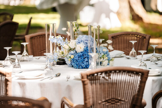 Festive table setting in the garden. Open-air restaurant.