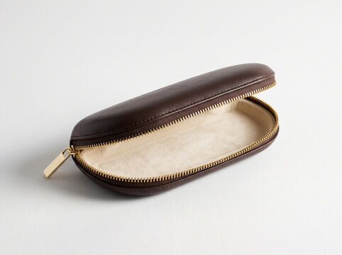 Brown leather glasses case open isolated