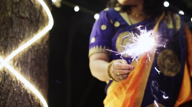 Joyful Diwali Night With women Enjoying Sparkler Fireworks Celebration