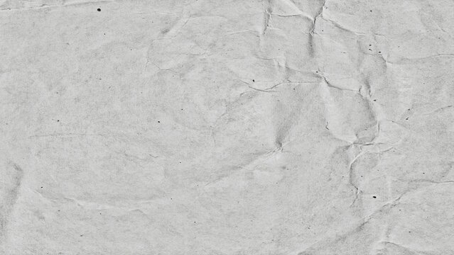 High-resolution white crumpled paper texture background featuring realistic folds, wrinkles, and natural creases.