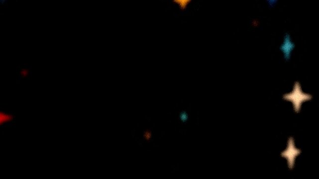 Colorful glowing stars loop. Beautiful multi-colored stars in retro grainy style flying through the camera. Light ray glowing with soft noise. 80s, 90s Retro futurism. Starry Neon lights glowing. 