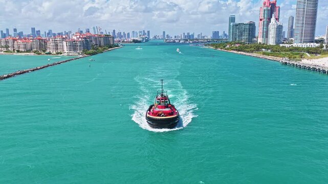 Boating and tugging. Tugboat sea transportation. Boat tug at sea. Aerial footage of tow boat transportation. Tugboat sailing at sea top view. Motor boat