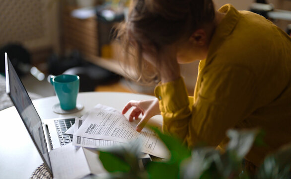 Stressed woman having financial problems with paying bills.