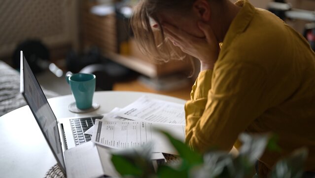 Stressed woman having financial problems with paying bills.