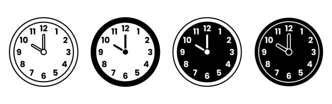Set Of Four Classroom Clocks Showing Different Times.