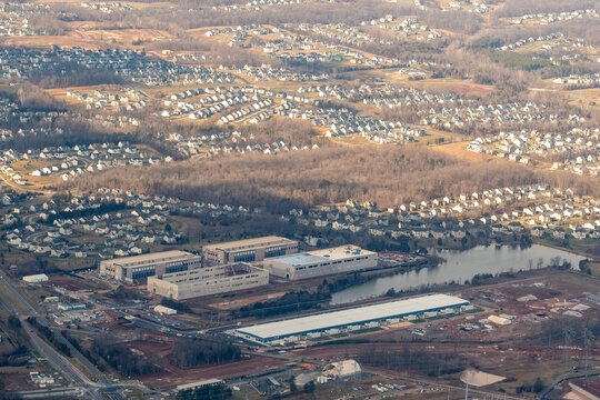 Aerial view of massive data centers under construction in Northern Virginia suburbs 