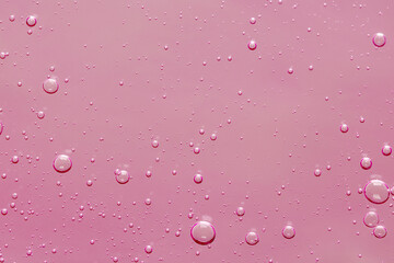 Obraz premium Pink transparent cosmetic product as background, closeup