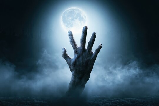 Creepy Zombie Hand Rising from Ground in Foggy Night Horror Halloween Background