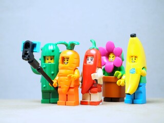 Fototapeta premium Indonesia - May 9, 2023 : Mini toy of Lego at table with blurred background. Miniature photography concept design.