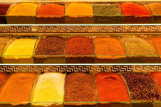 Various colorful spices displayed on shelves in Spice Bazaar in İstanbul, Turkey