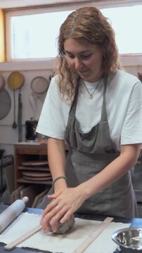 Young Woman Engaged in Ceramic Making