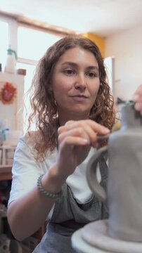 Young Woman Shaping Ceramic Art