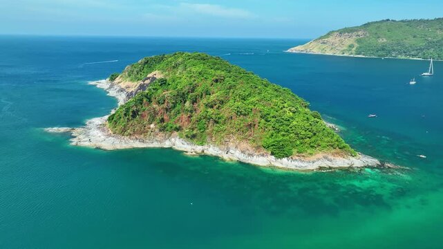 Aerial view Drone camera of seashore rocks in summer season, Beautiful sea in Phuket Thailand, Amazing sea waves crashing on rocks seascape in Phuket island Thailand