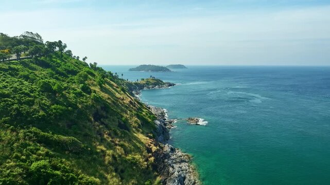 Aerial view Drone camera of seashore rocks in summer season, Beautiful sea in Phuket Thailand, Amazing sea waves crashing on rocks seascape in Phuket island Thailand