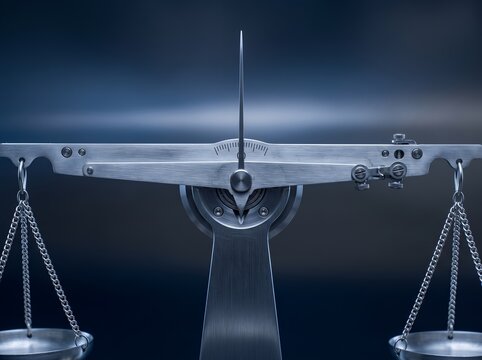 Precision mechanical balance scale showing metallic beam and indicator needle against dark background