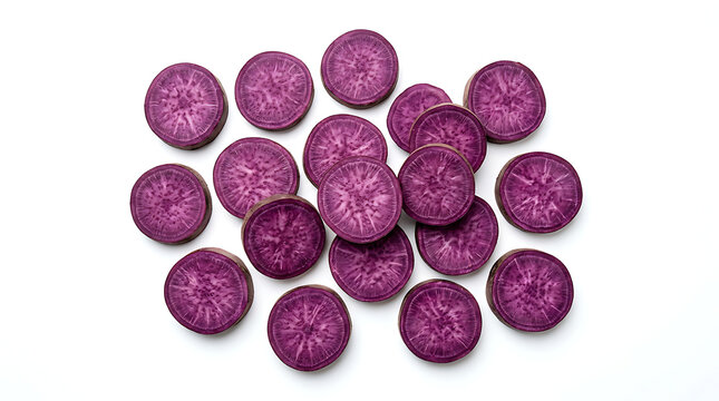 Raw purple sweet potato slices on white. Fresh organic yam rounds for healthy cooking.