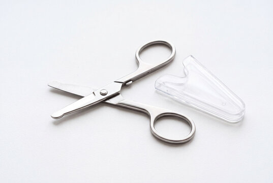 Tiny Folding Travel Scissors with Blunt Tips and Plastic Sheath on White &ndash; 5K Ultralight EDC Tool