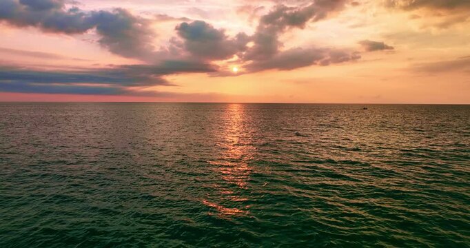Beautiful sky sunset or sunrise over sea surface beautiful wave Amazing light twilight sky sunset. Cinematic footage beautiful light of nature seascape Landscape	
