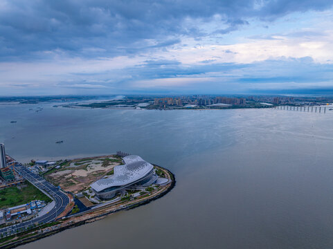 Zhanjiang Jinshawan river view featuring modern architecture and urban skyline at dusk