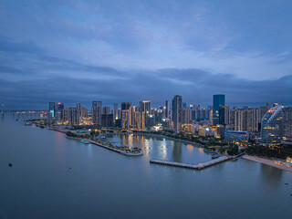 Obraz premium Zhanjiang Jinshawan bay night view with city skyline and waterfront architecture