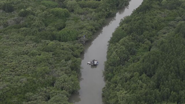 Aerial drone footage of Can Gio Mangrove Forest and winding rivers in Ho Chi Minh City, Vietnam, showcasing UNESCO biosphere reserve, lush wetlands and pristine tropical landscape.