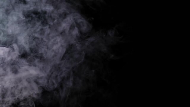 Abstract White Smoke Swirling on Black Background, Dramatic Fog Texture, Vapor Mist Overlay, Atmospheric Effect, Dark Moody Background for Creative Design
